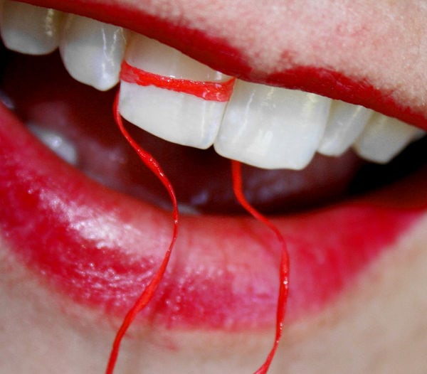 free macro white teeth with dental floss and red lipstick creative commons l
